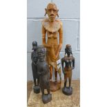 Four carved wooden tribal figures