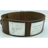 A leather greyhound collar with owner's name and dog's name