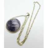 A large silver pendant set with 3cm circular Blue John cabochon on a silver chain