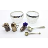 A pair of silver rimmed salts, small silver salt and pepper pots and a miniature boot pin cushion