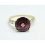 A 9ct gold, garnet and diamond ring, 2.4g, S