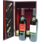 Two bottles of wine in a presentation case with accessories