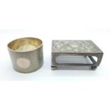 A silver match box holder and a silver napkin ring, 87.4g