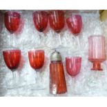 A collection of cranberry glass