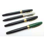 Four Sheaffer pens with pump action fillers, two with 14ct gold nibs