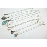 Seven silver gem set pendants and chains