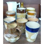 Ten items of stoneware including Doulton and Bourne Denby and a London pub water jug, The George &