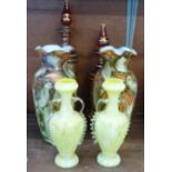 Two pairs of glass vases and two pink glass vases with lids, yellow pair 19cm