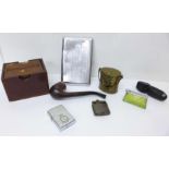 Four cigarette lighters, a plated cigarette case, a wooden cigarette dispenser and a brass vesta