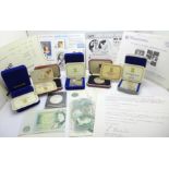 A collection of Pobjoy Mint silver proof coins, boxed, and a 1976 Isle of Man commemorative crown