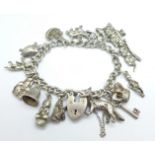 A silver charm bracelet, clasp and bracelet stamped silver, all charms test as silver, 76.2g