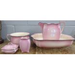 A Royal Winton five piece pink toilet set **PLEASE NOTE THIS LOT IS NOT ELIGIBLE FOR POSTING AND