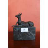 A small bronze figure of a horse on a marble plinth