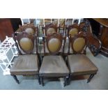A set of six Victorian mahogany and upholstered dining chairs