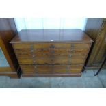 An early 20th century pitch pine six drawer plan chest