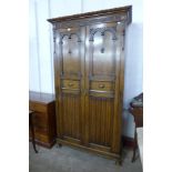 A carved oak wardrobe