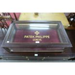 A table top display cabinet bearing Patek Philippe inscription