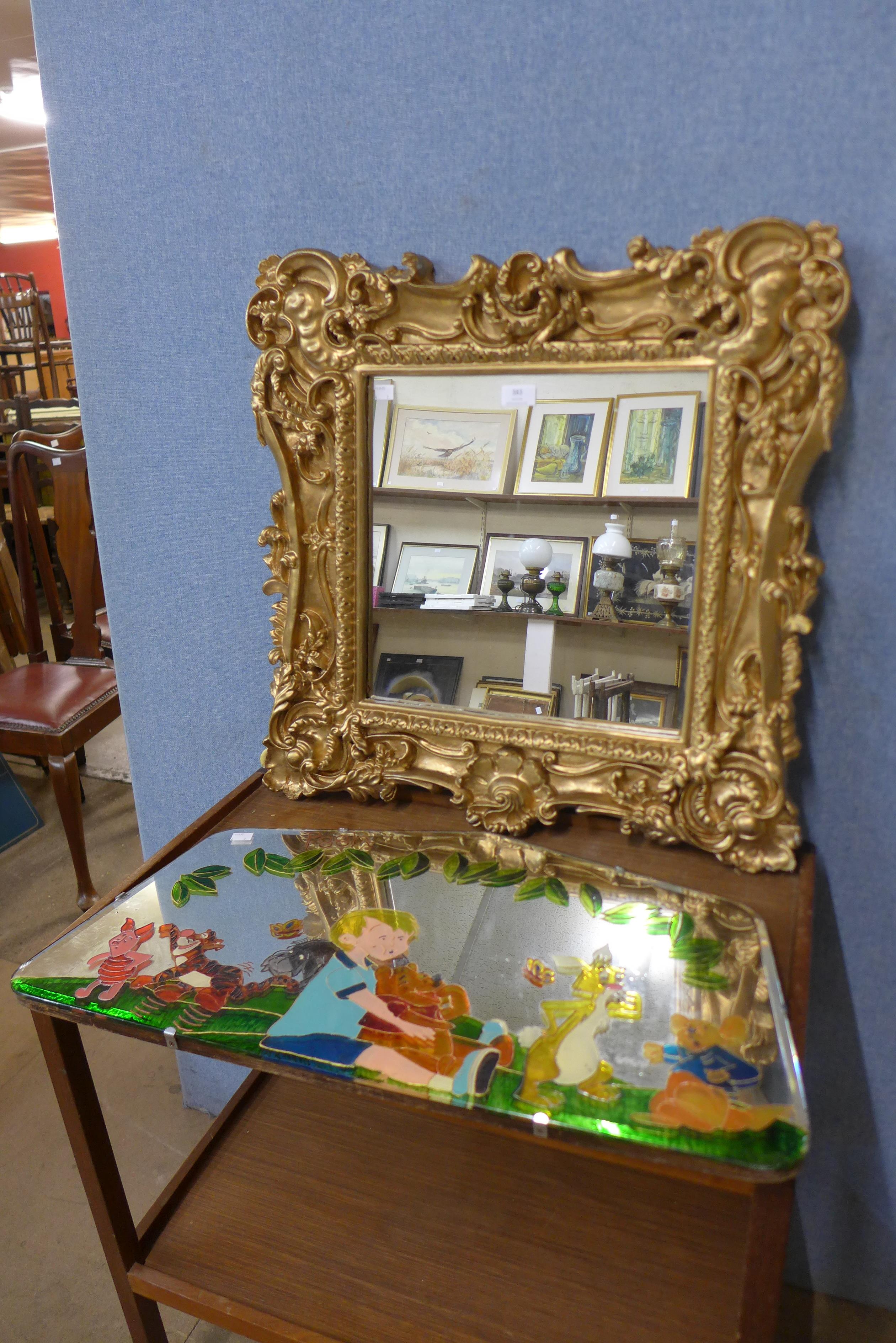 A Rococo style gilt framed mirror and a painted framed mirror