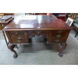 An Edward VII rosewood writing table