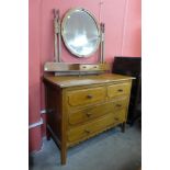 An Arts and Crafts oak dressing chest