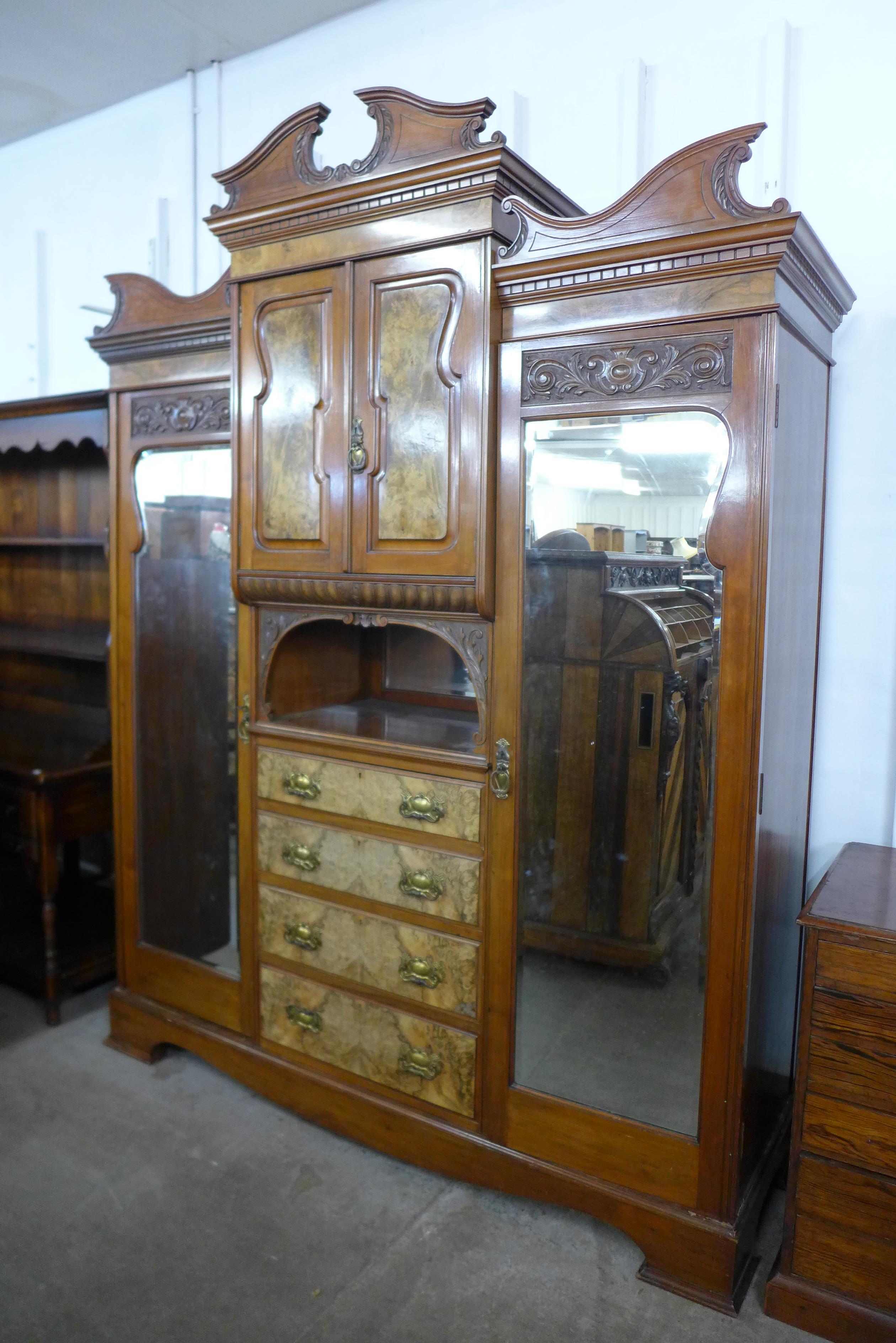 A Victorian carved walnut combination wardrobe