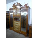 A Victorian carved walnut combination wardrobe