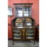A Victorian inlaid mahogany display cabinet