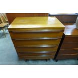 A teak five drawer chest