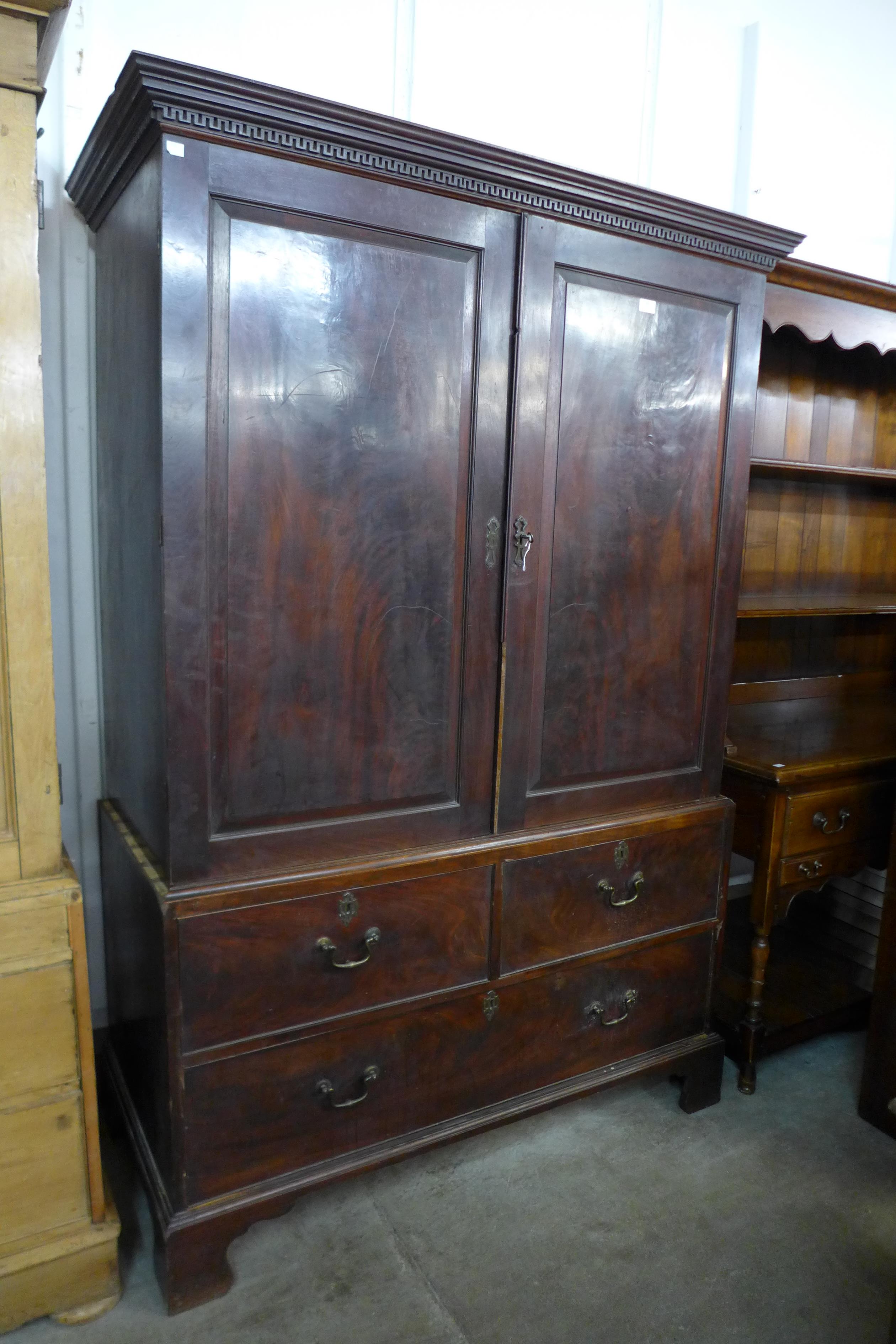 A Victorian mahogany linen press ( missing internal slides)