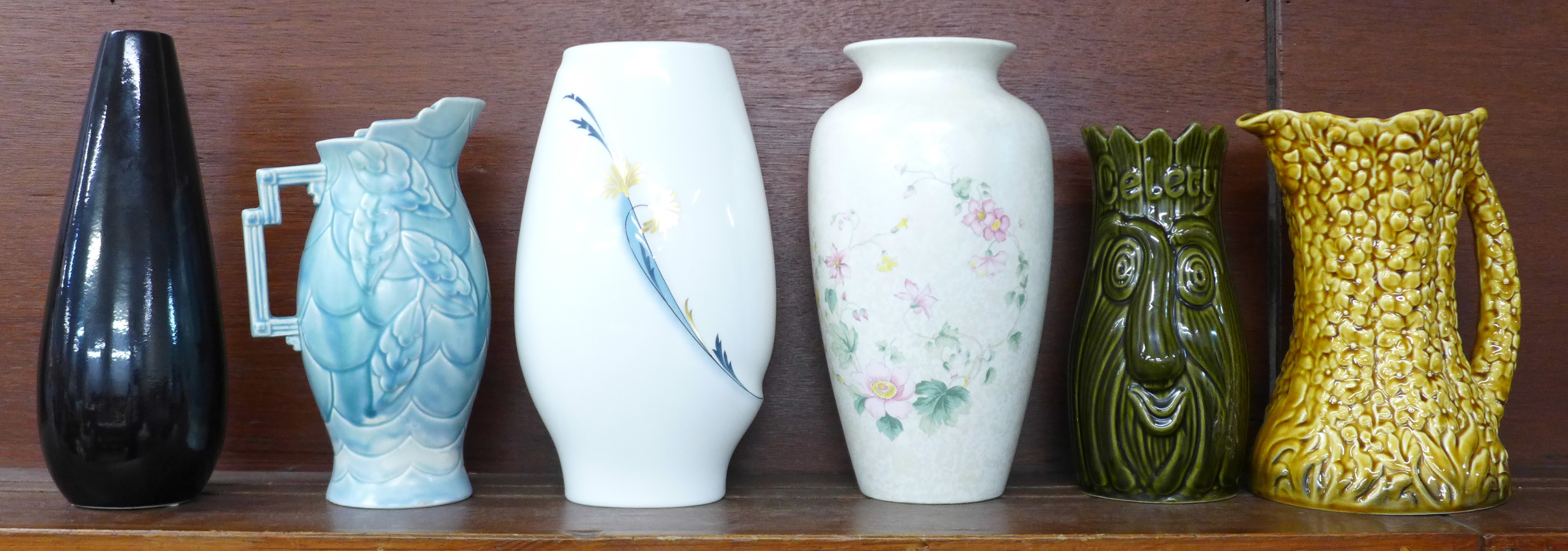 Six vases including Wedgwood, Poole and Sylvac, (blue and yellow jugs a/f)