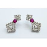 A pair of silver gilt earrings set with ruby and diamond simulants