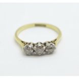 An 18ct gold and platinum set three stone diamond ring, 2.7g, P