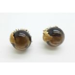 A pair of 14ct gold and cabochon smoky quartz set earrings, stones approximately 14mm in diameter,