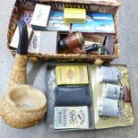 A collection of cigarette lighters, matches and other smoking related items