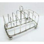 A George III silver toast rack, London 1810, 205g