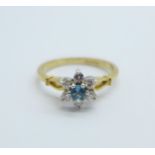 A 9ct gold, topaz and diamond cluster ring, 2.3g, N