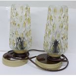 A pair of 1970's continental table lamps with glass shades