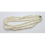 A pearl necklace with a silver clasp