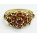 A 9ct gold and garnet cluster ring, 2.5g, K