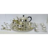 A pair of silver sugar bows, 11.5g, a silver mounted fork, a three piece plated tea service and
