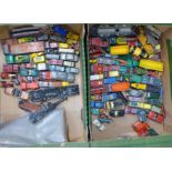Two boxes of die-cast model vehicles and a cap gun