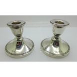 Two silver dwarf candlesticks with Bakelite bases, Chester and Birmingham hallmarks