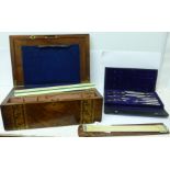 A writing box, a cased set of drawing instruments, a slide rule and ruler