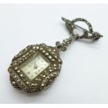 A silver and marcasite brooch watch