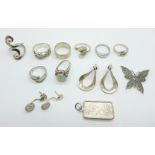 Eight silver rings, two pairs of silver earrings and two silver pendants including one half ounce
