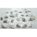 Twenty-five silver pendants and chains