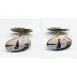 A pair of Scandinavian silver gilt double enamel seascape scene cufflinks