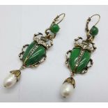 A pair of scarab beetle earrings