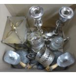 A pair of plated candlesticks, a pair of plated coasters, water jugs, pickle jar, sugar bowl,