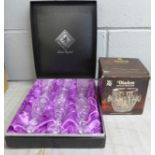 A set of Edinburgh lead crystal glasses, boxed and a WMF glass bowl, boxed